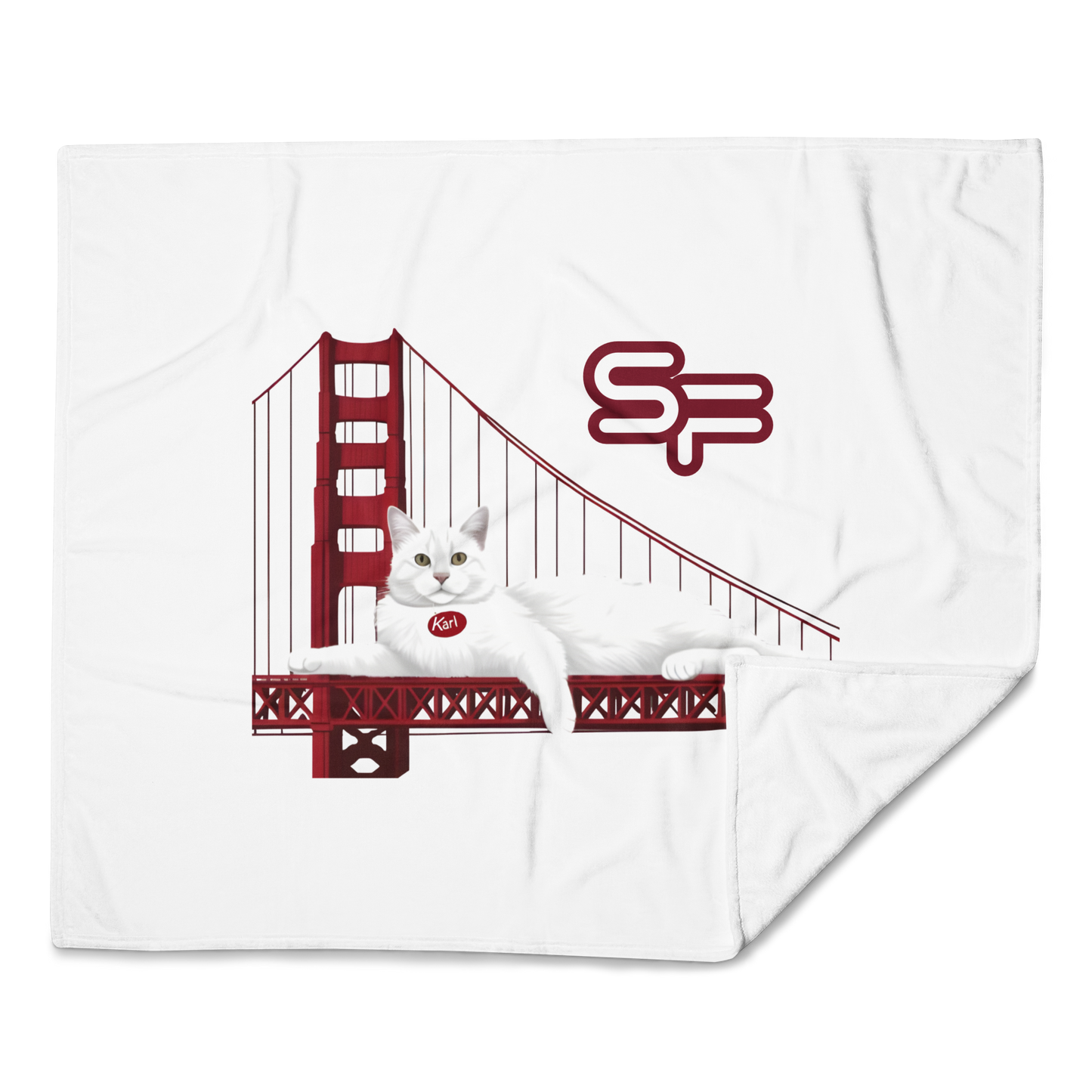 Blanket with a design of a cat on the Golden Gate Bridge and 'SF' letters.