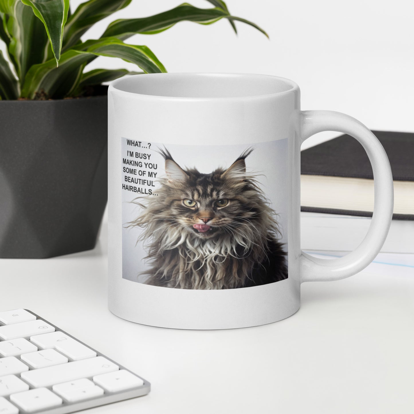 A white mug with a cat meme about hairballs - 20 oz