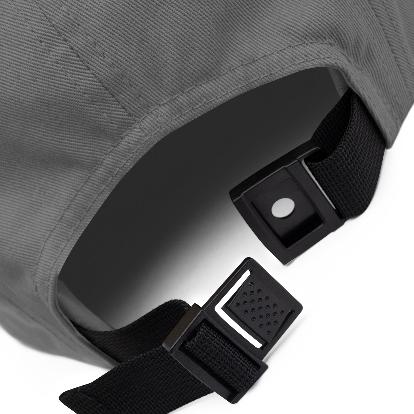 Close-up of a gray bag with black straps and buckles on a white background - grey