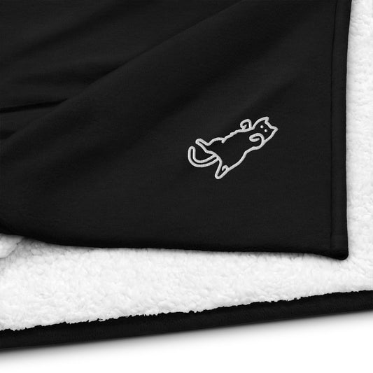 Cat laying on its back comfortably - Black