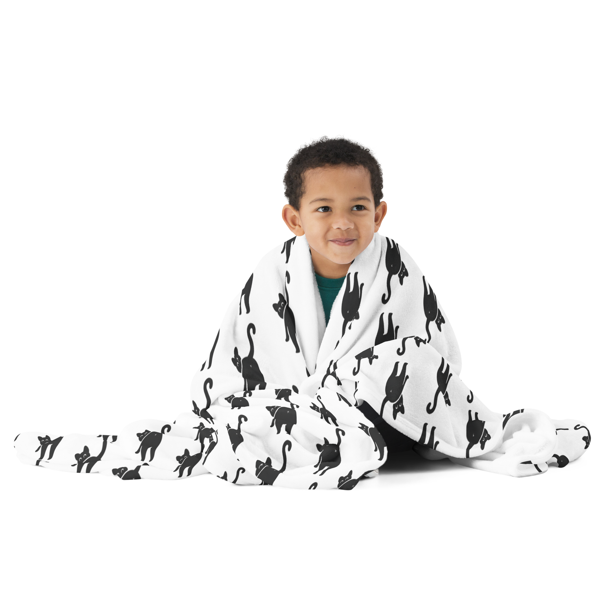 Child wrapped in a black and white patterned blanket on a white background - all