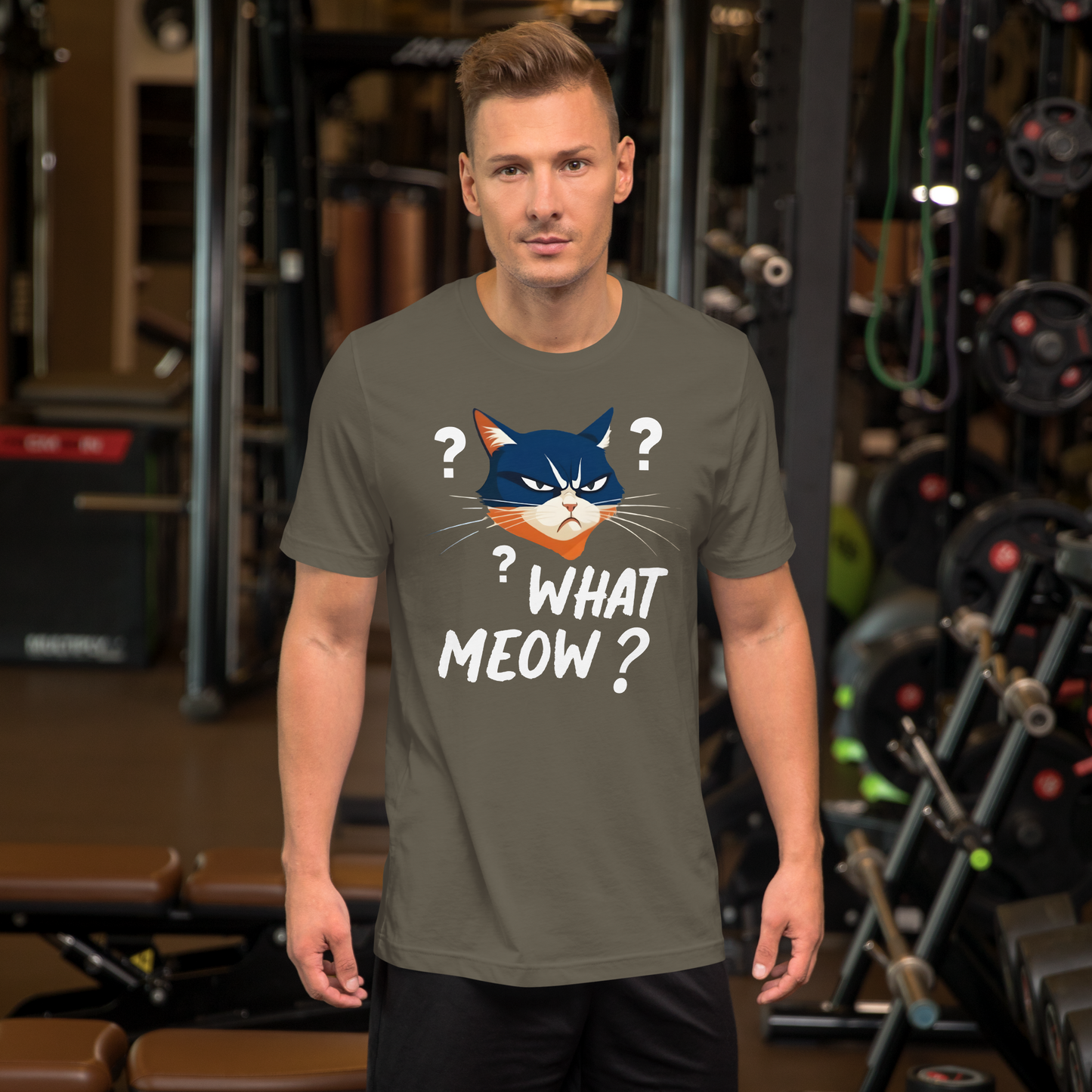 Man wearing a t-shirt with a cat graphic and text in a gym setting - army
