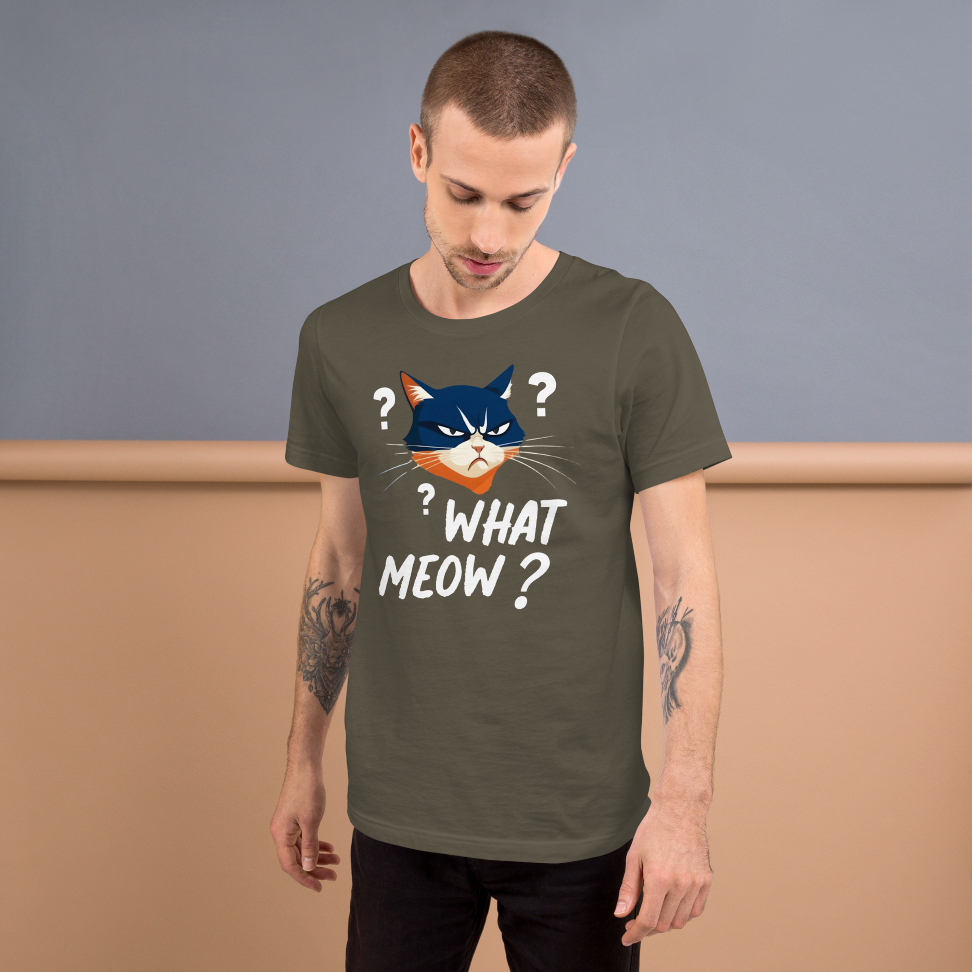 Man wearing a green t-shirt with a cat graphic and text, standing against a plain background - army