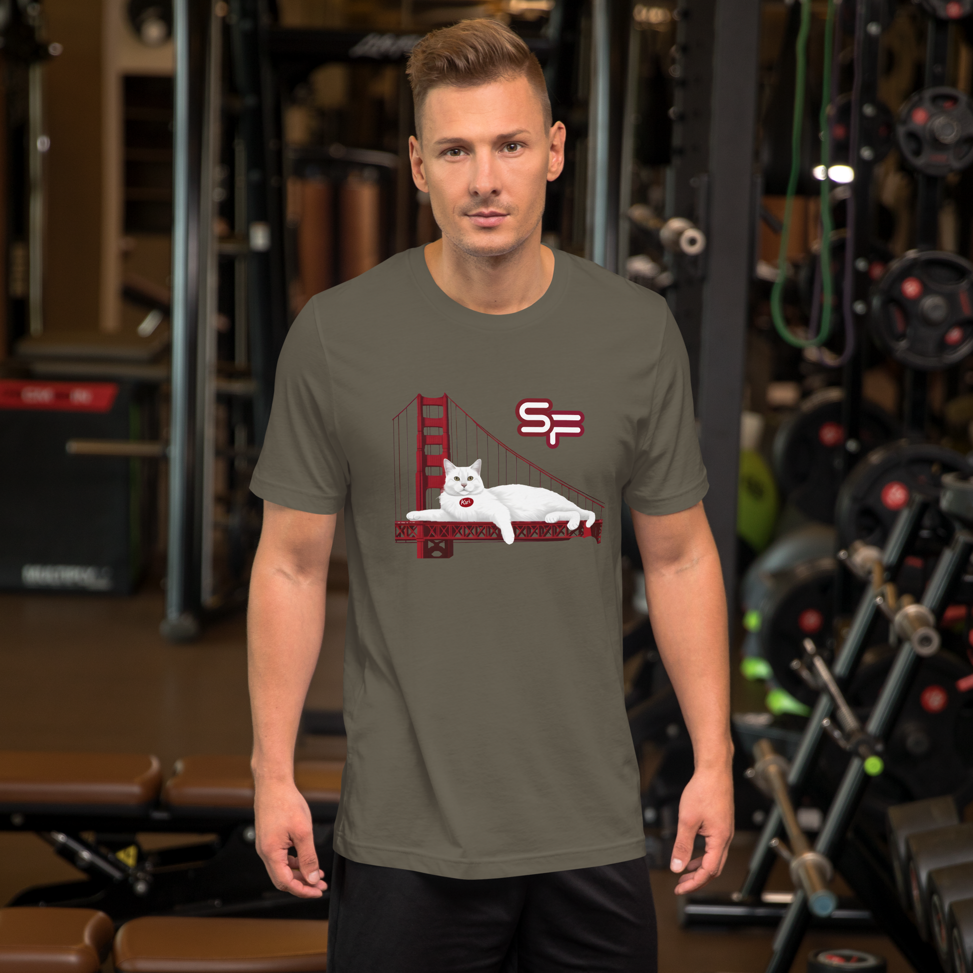 Man wearing a t-shirt with a graphic design in a gym setting - army