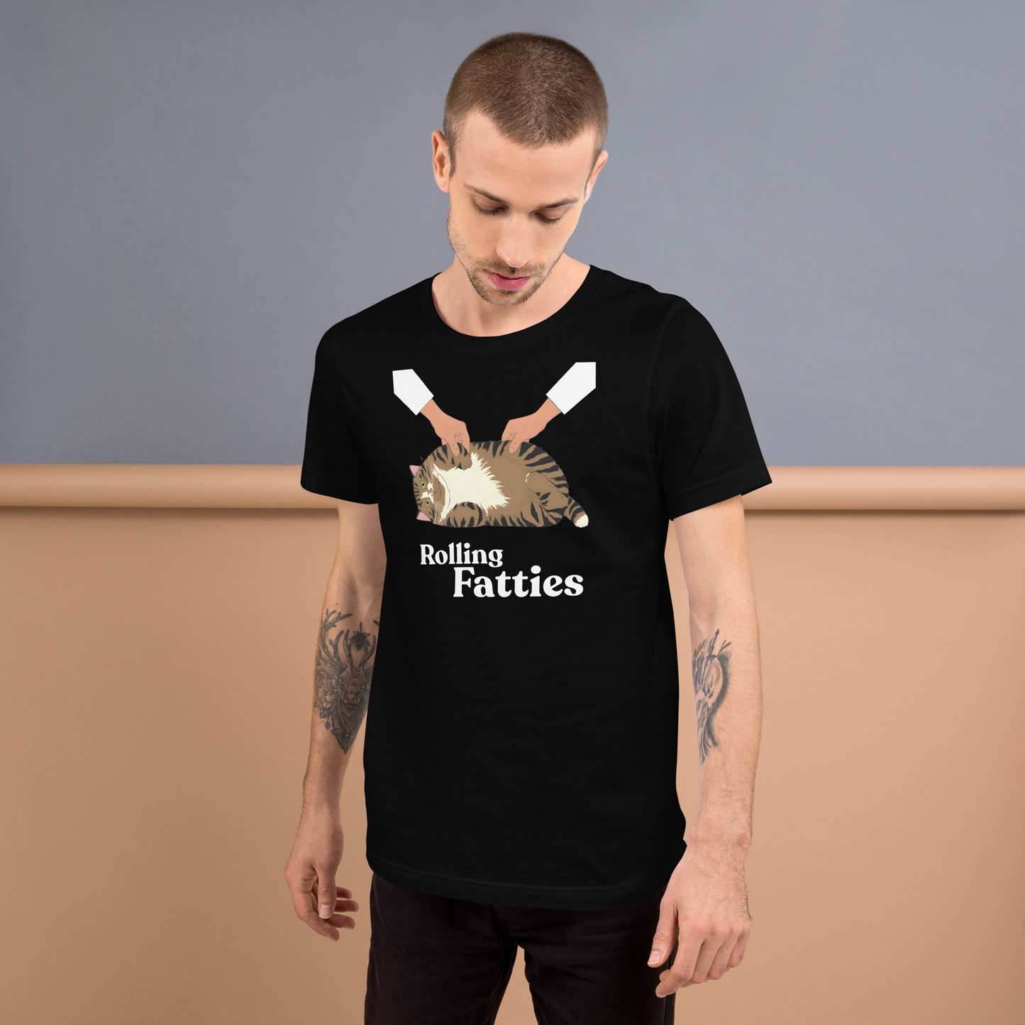 Man wearing a black t-shirt with 'Rolling Fatties' graphic design against a plain background - black