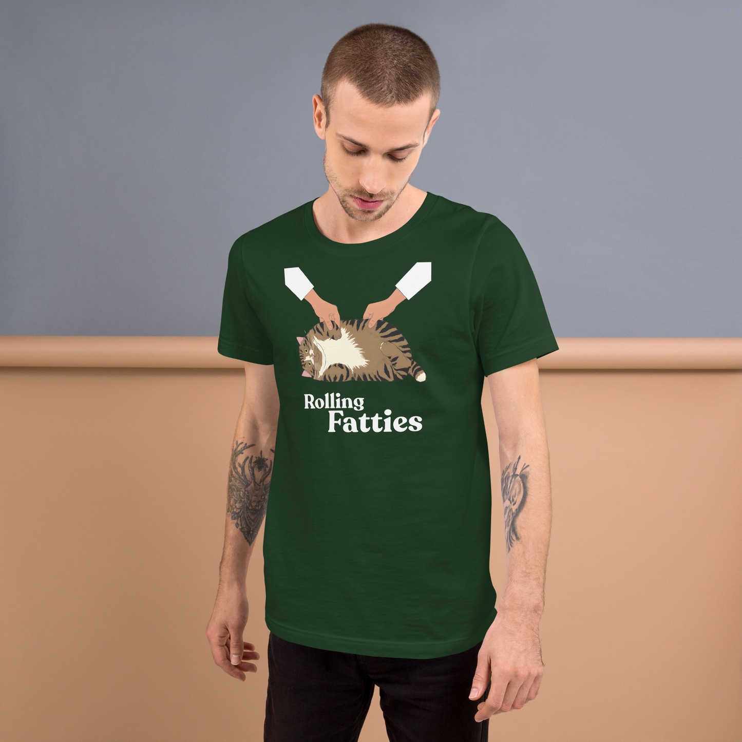 Man wearing a green t-shirt with 'Rolling Fatties' graphic design against a plain background - forest