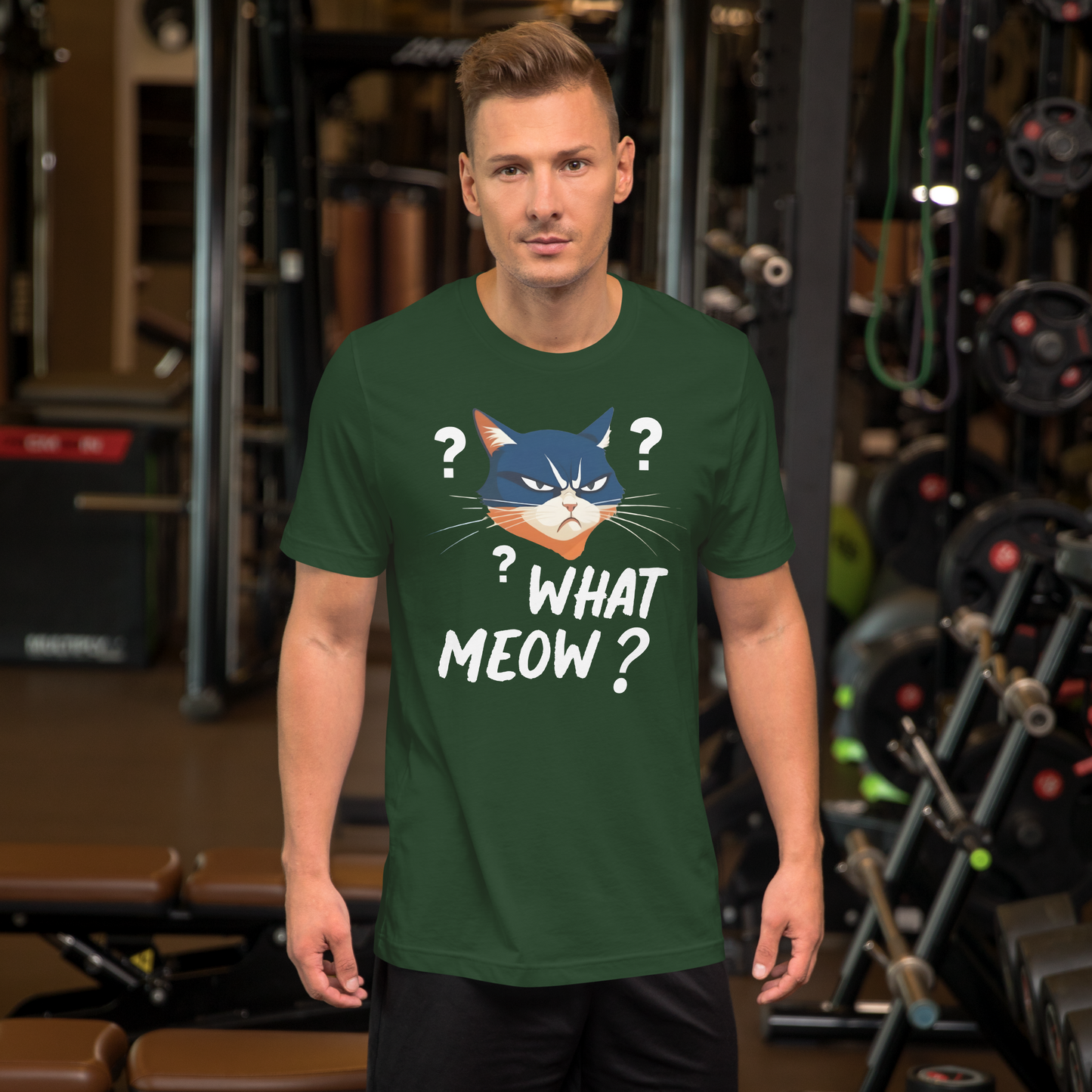 Man wearing a green t-shirt with a cat graphic and text in a gym setting - forest
