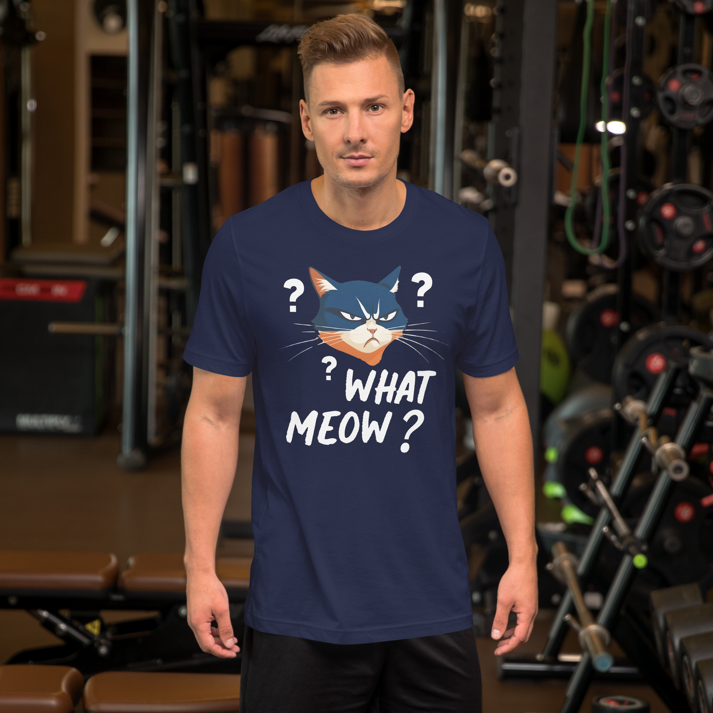 Man wearing a navy blue t-shirt with a cat graphic and text in a gym setting - navy