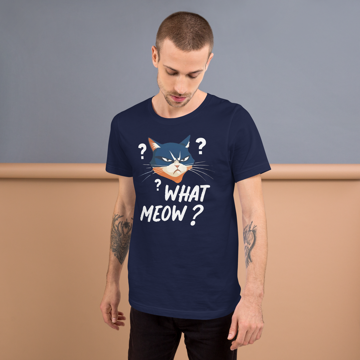 Man wearing a navy blue t-shirt with a cat graphic and text, standing against a plain background. - navy