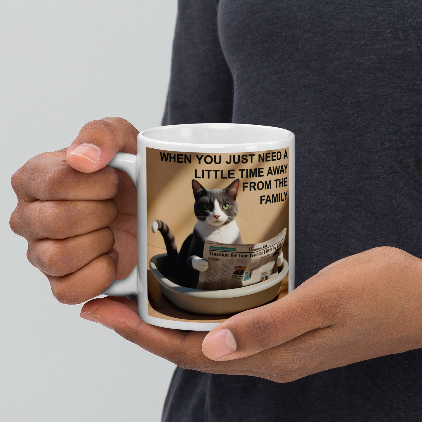 Person holding a mug with a cat design and text on a gray background - 11 oz