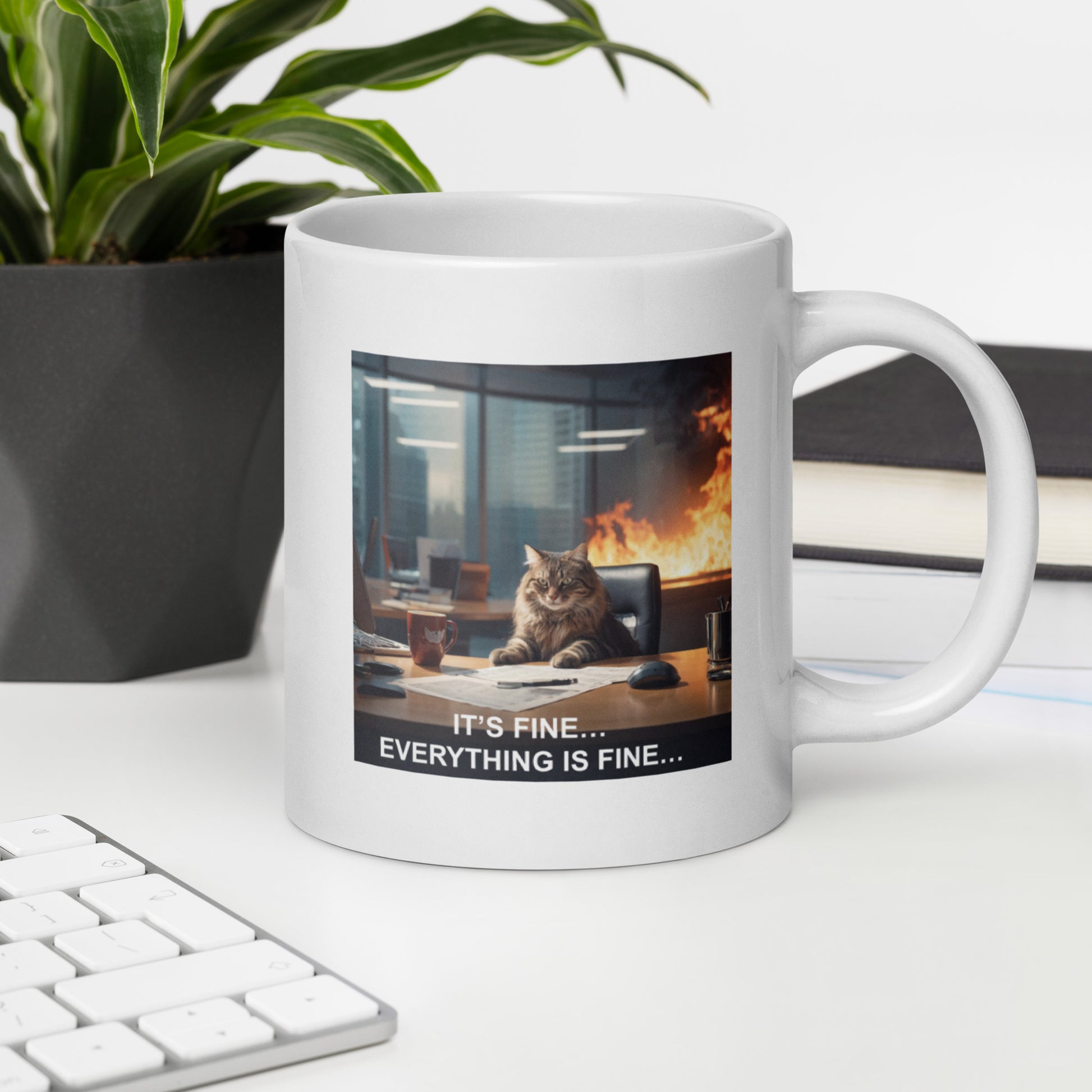 A mug with a meme of a cat drinking his coffee in a burning building saying that everything is fine - on desk - 20 oz