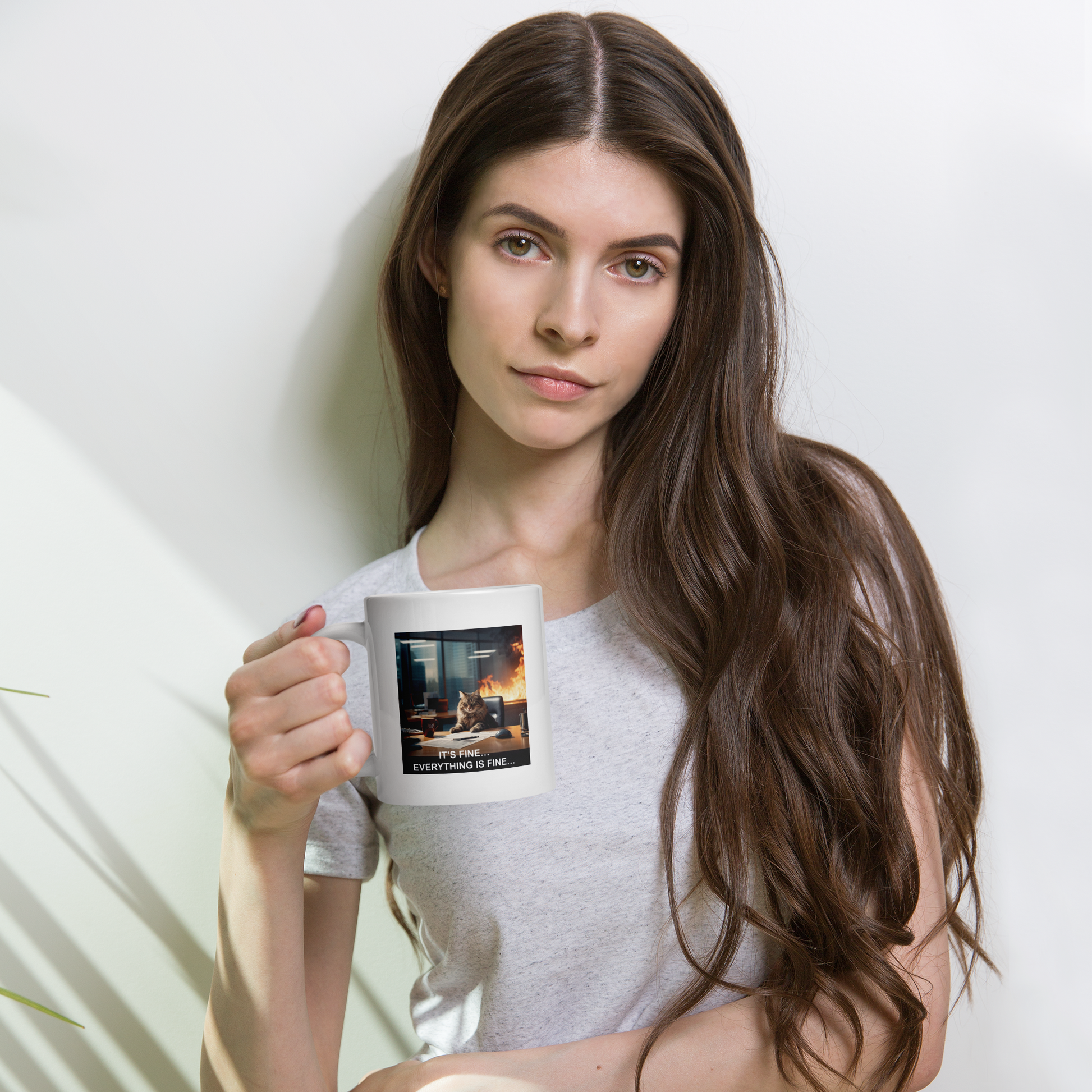 Woman holding a mug with a printed design against a plain background - 20 oz